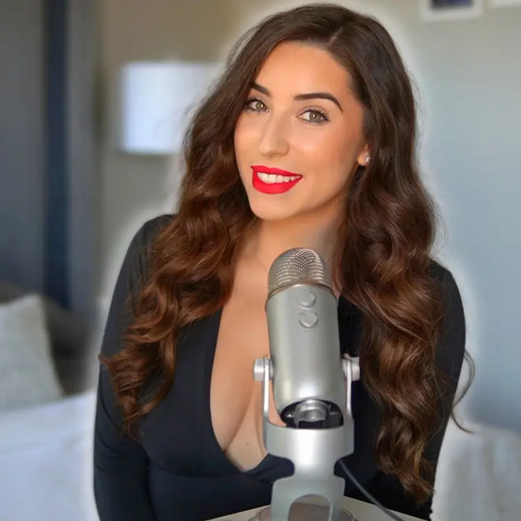 Creator ASMRxBABEE's headshot, sitting with a microphone