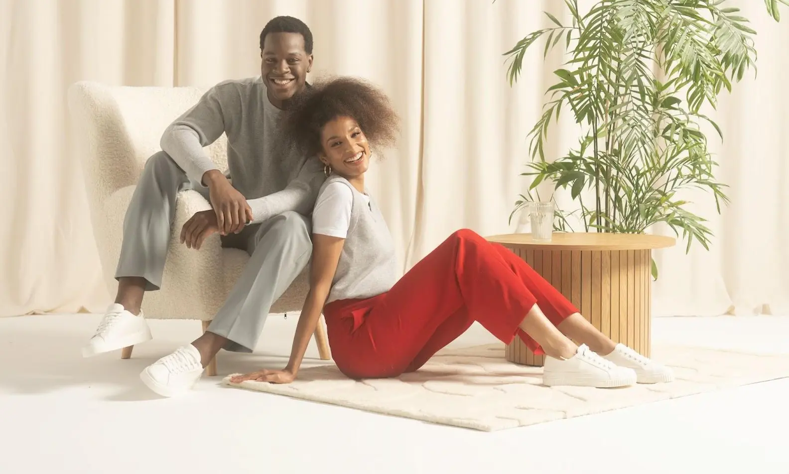 An image of two models in knit sweater and cardigan